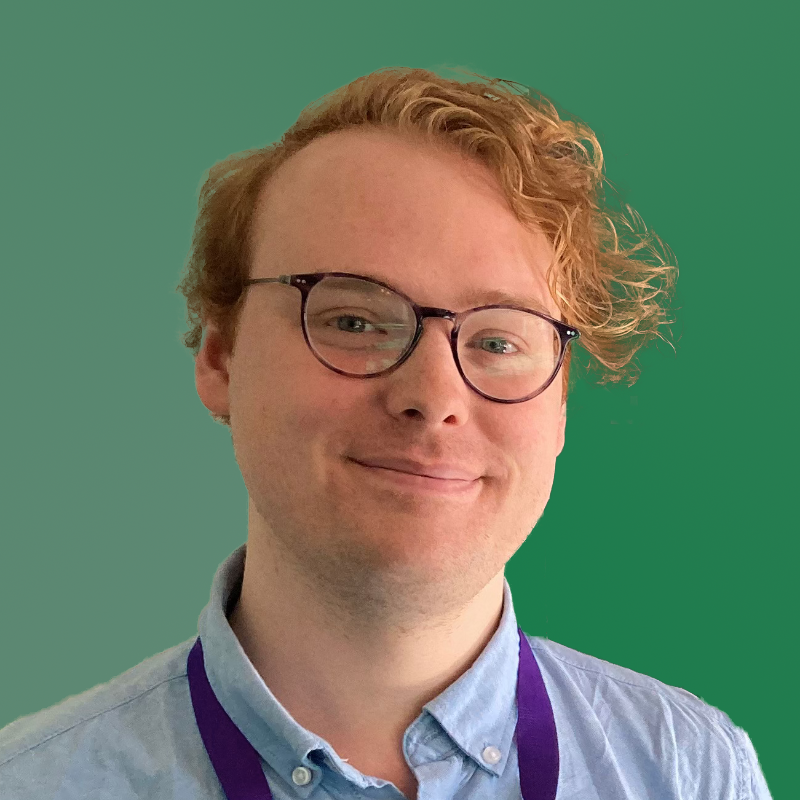 photo of myself a white masculine presenting person wearing a cloth facemask and a green jacket